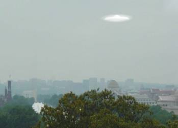 Alien saucer races south from Seattle.