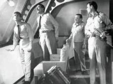 Frankie Avalone, Walter Pidgeon, Peter Lorre and Robert Sterling survey fowled mine.
