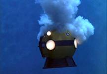 The stuff decends and begins to engulf the diving bell.