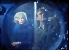 Nelson and Katya look into a giant's eyes.