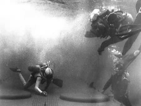 Rare out-take shows underwater photographers, probably one of whom is John Lamb in the tank at 20th.