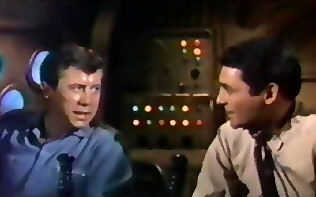 Patterson consults easily with Captain Crane.