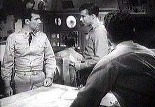 Paul Comi as Bishop, Carl Reindel as Evans.  Derrik Lewis as O'Brien looks on as  in the background, Robert Doyle as Blake is about to be fatally disracted from sonar. 